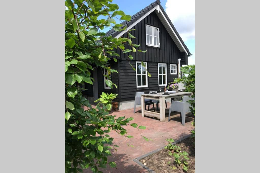 Uniek houten huis nabij bos en plassen Hollandsche Rading Buitenkant foto